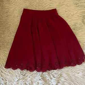 Maroon full skirt with scallop detail at hem